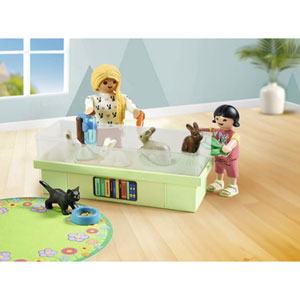 Animalerie avec enclos à lapins et tapis de jeux