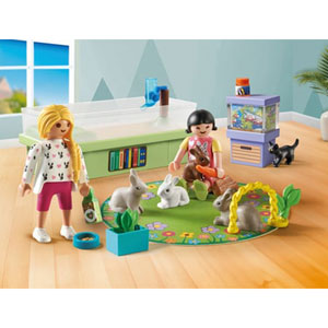 Animalerie avec enclos à lapins et tapis de jeux